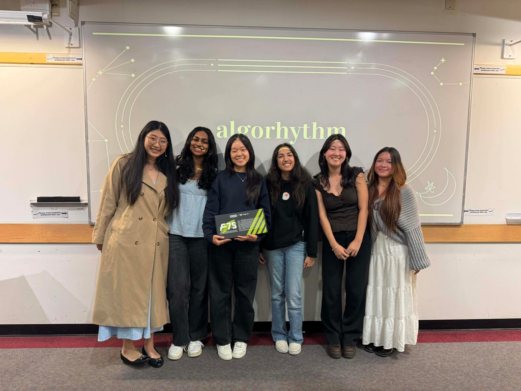 The AlgoRhythm team in front of their presentation title slide